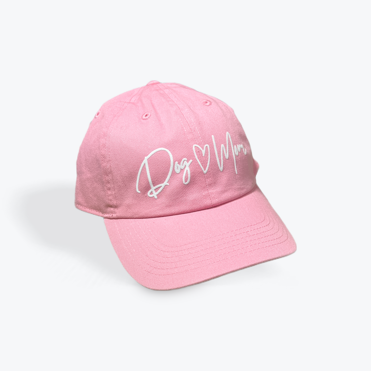 Dog Mom pink baseball cap with white lettering, perfect for dog lovers.