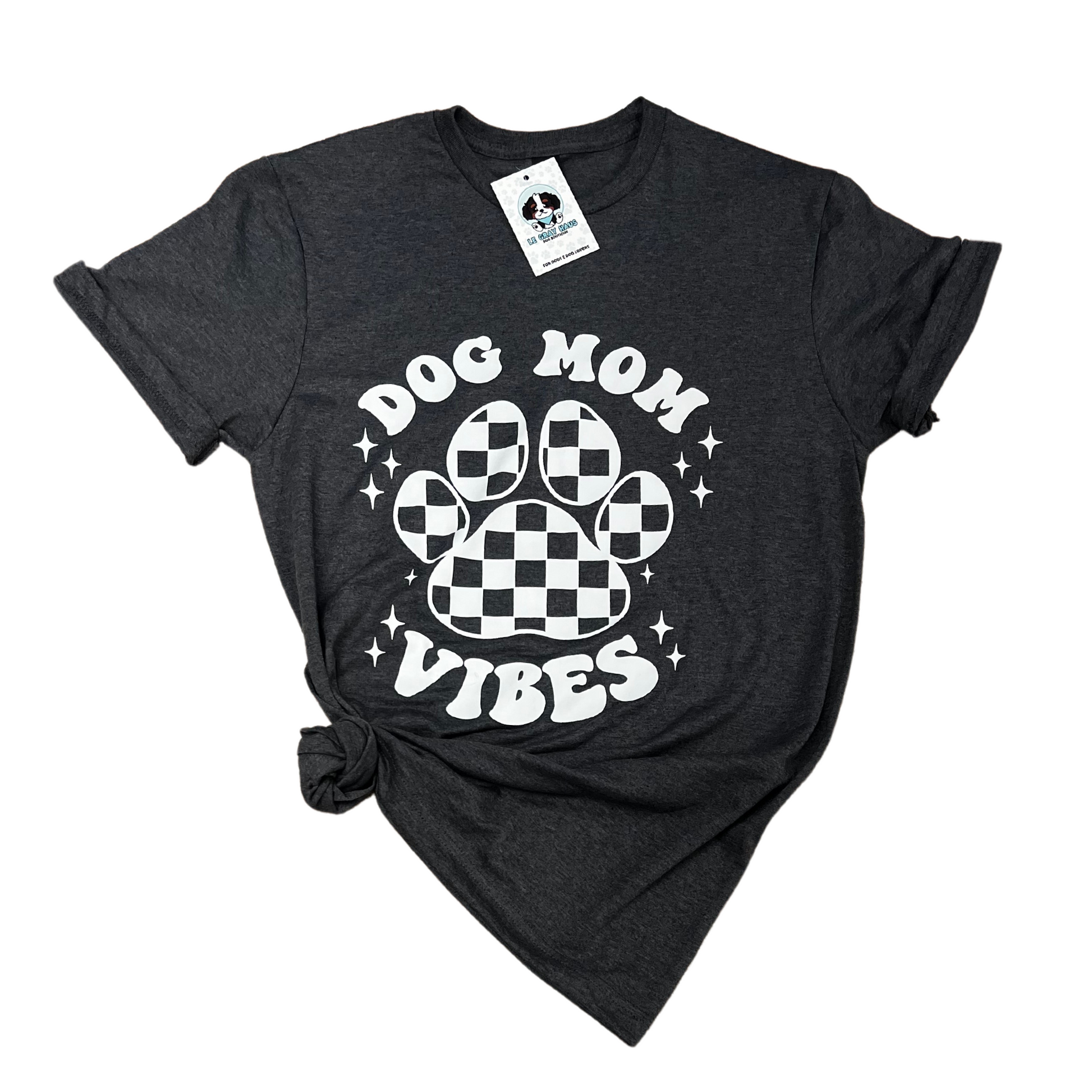 Dog Mom Vibes t-shirt featuring a checkered paw print design on a dark background.