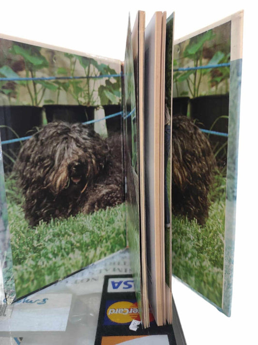 Dog Photo Album featuring a fluffy dog on the cover, showcasing vibrant colors and a unique design.
