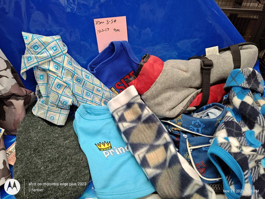 Dog sweaters collection featuring various colors and patterns, including blue and gray options.