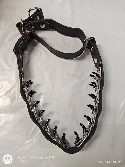 Dog training collar with metal prongs for effective behavior correction.