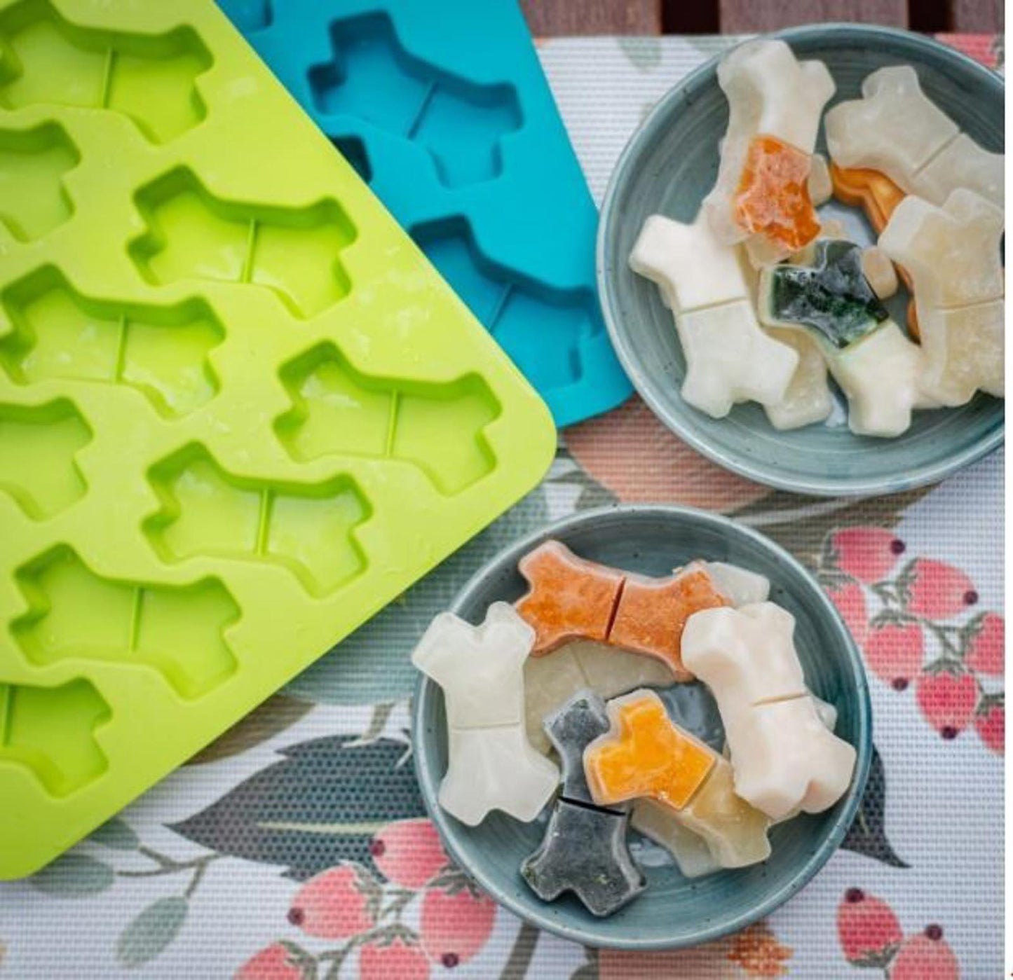 Dog Treat Silicone Mold for making fun bone-shaped treats in various colors.