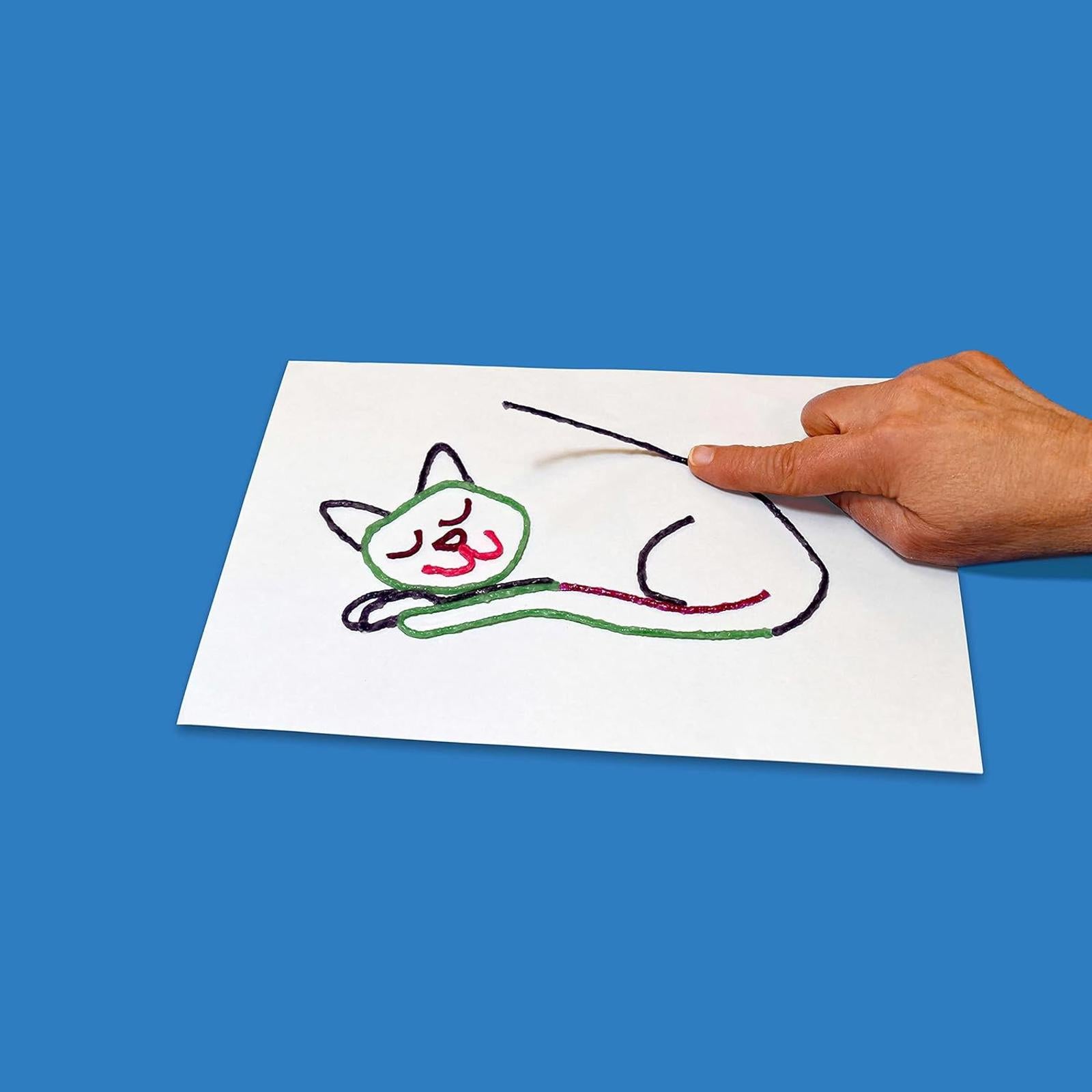 Cat Drawing Kit featuring a hand tracing a colorful cat illustration on paper.