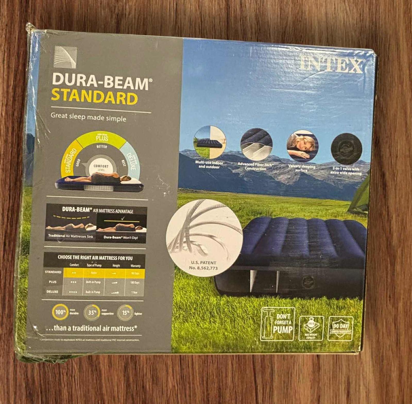 Dura-Beam Standard air mattress with a scenic mountain background, featuring a comfortable design.