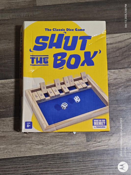 Shut the Box game box featuring a wooden board and dice, ideal for family fun.