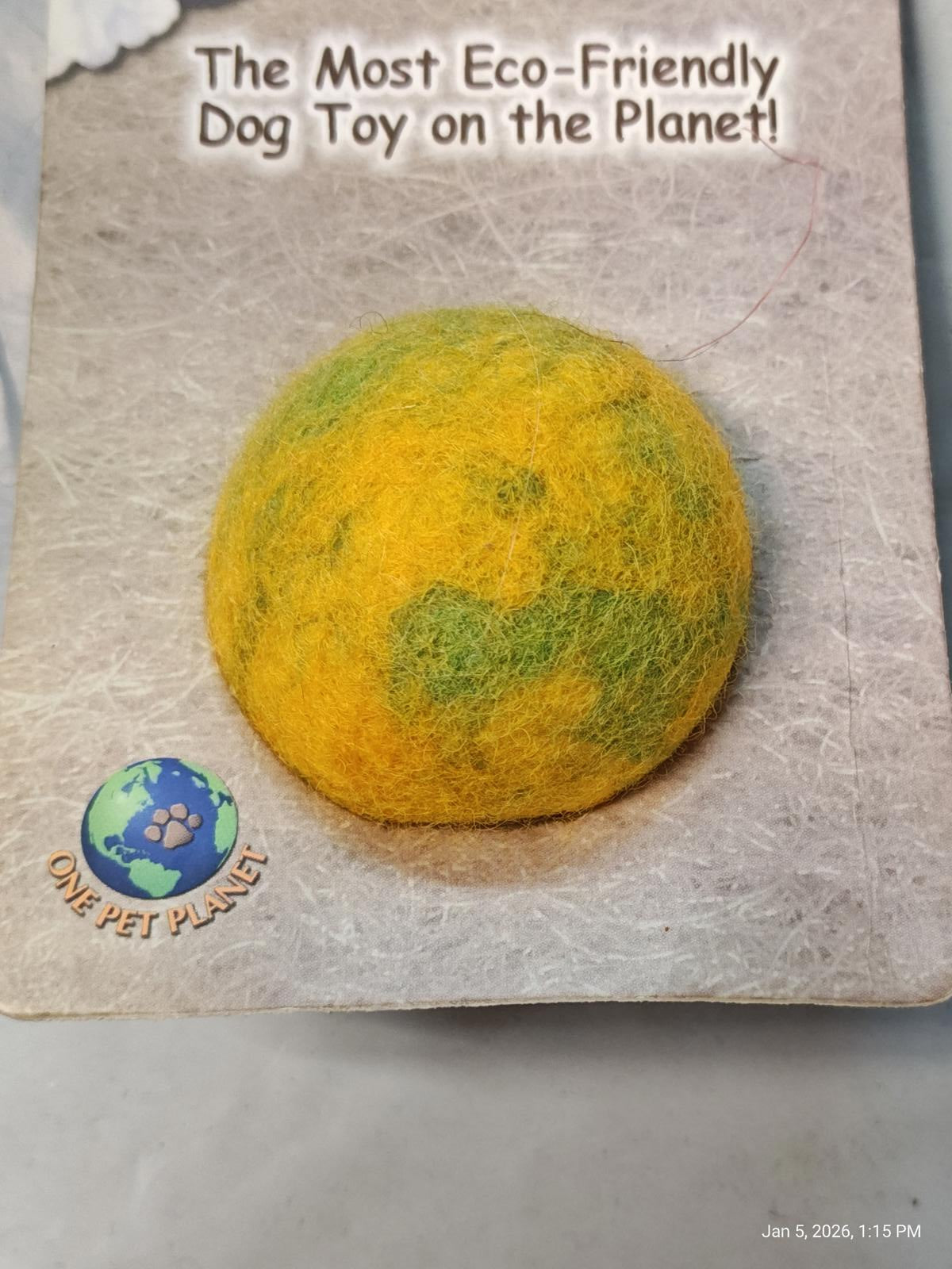 Eco-Friendly Dog Toy features a vibrant yellow and green design resembling the Earth.