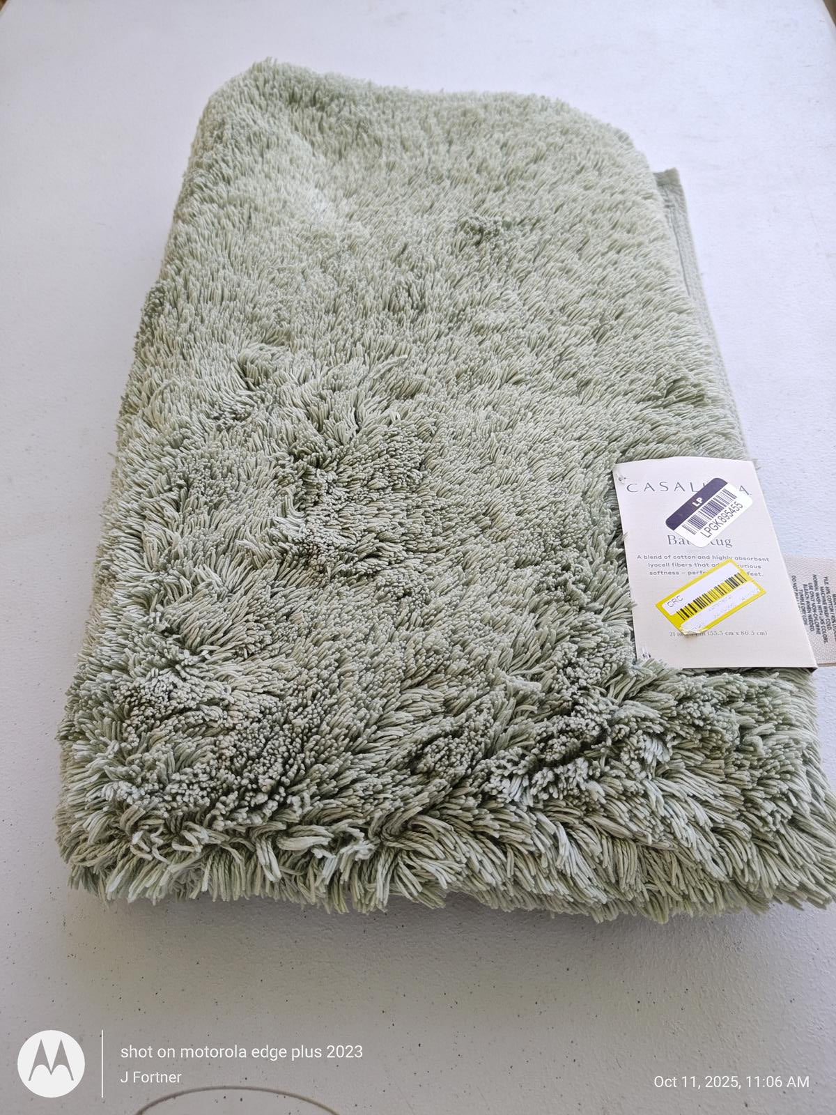 Soft green bath towel from the Matador Edge Plus collection, featuring plush texture and tags.