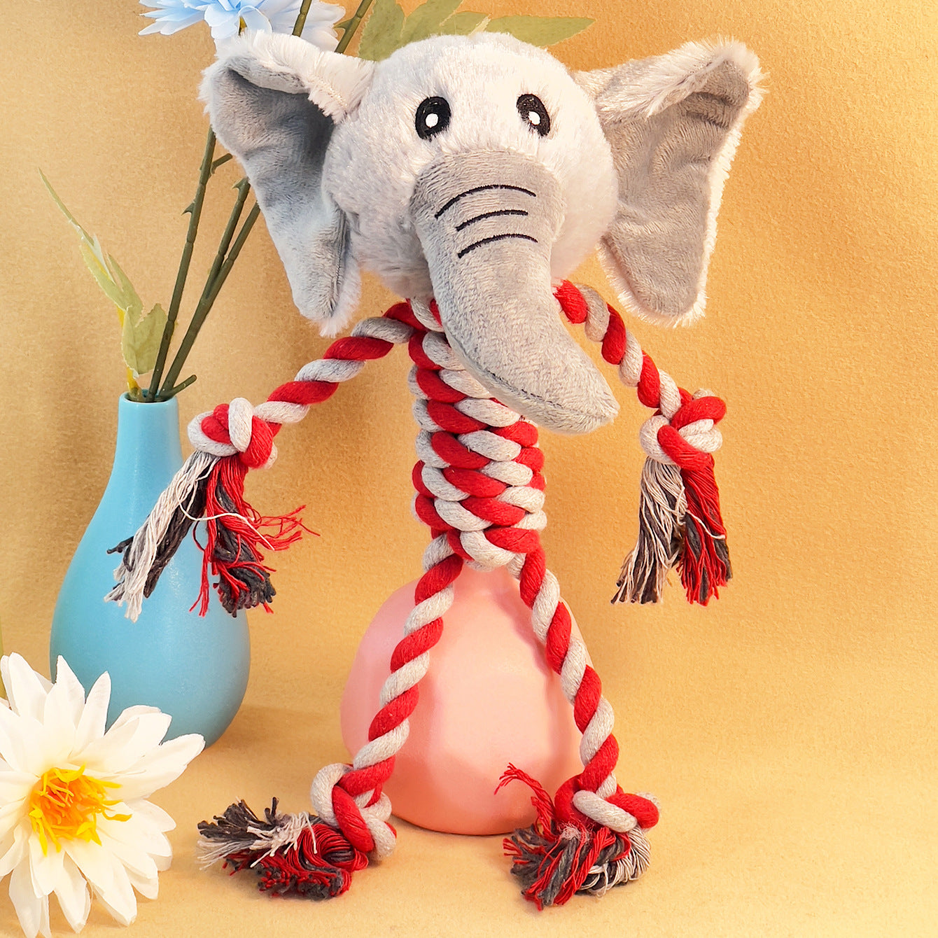 Elephant plush toy with rope limbs, perfect for playful pets.