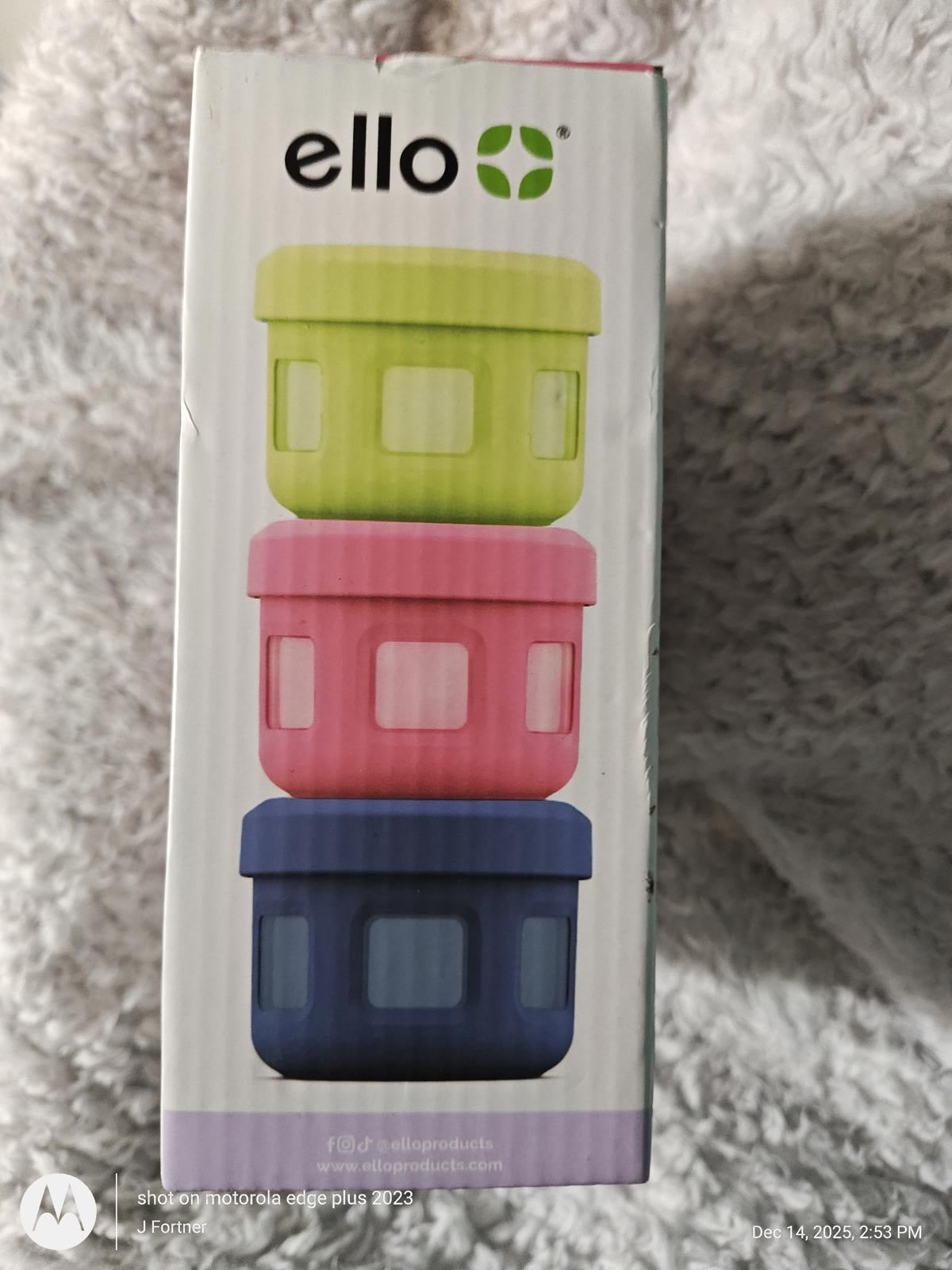 Ello food storage containers stacked in green, pink, and blue colors.