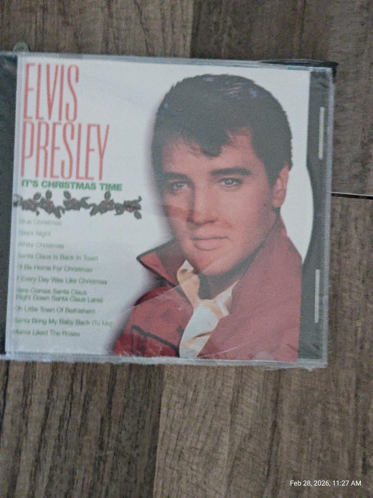 Elvis Presley It's Christmas Time CD cover featuring a portrait of Elvis with a red jacket.
