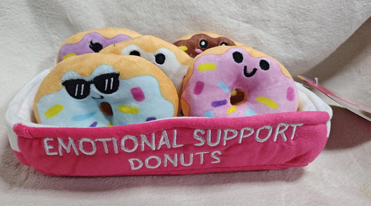 Emotional Support Donuts plush toys in a basket, featuring colorful designs and cute faces.