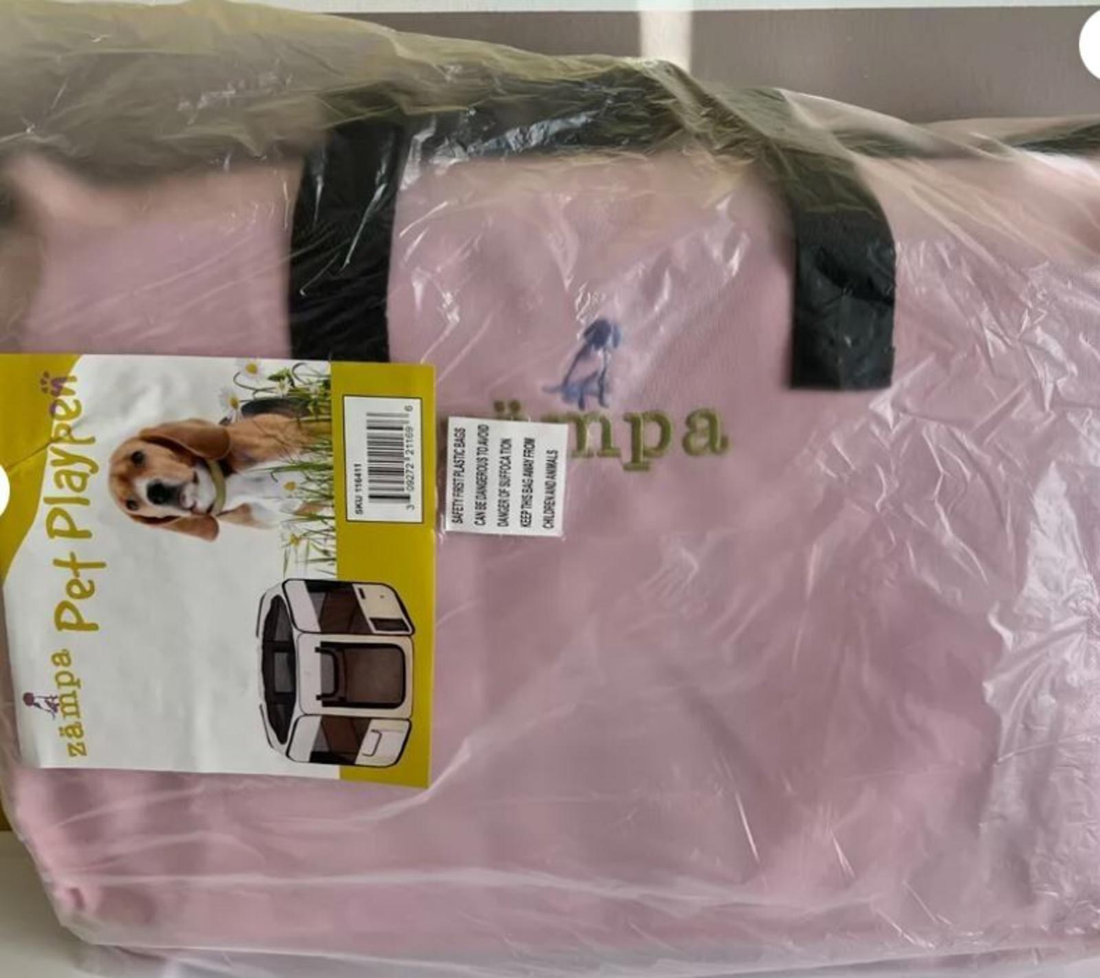Pet Playpen in pink color with a dog graphic and logo visible on the front.