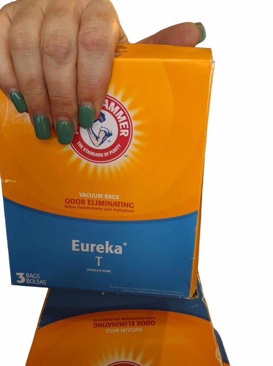 Eureka T odor eliminating bags in bright orange and blue packaging, held by a hand with green nails.