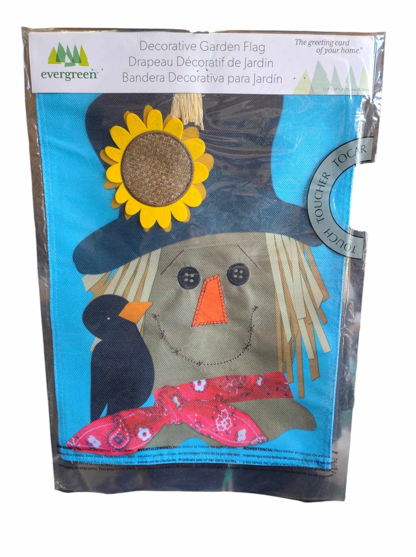 Evergreen decorative garden flag featuring a cheerful scarecrow with a sunflower hat and a black bird.
