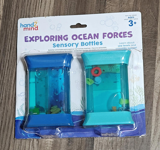 Exploring Ocean Forces sensory bottles in blue and teal, designed for sensory play and learning.