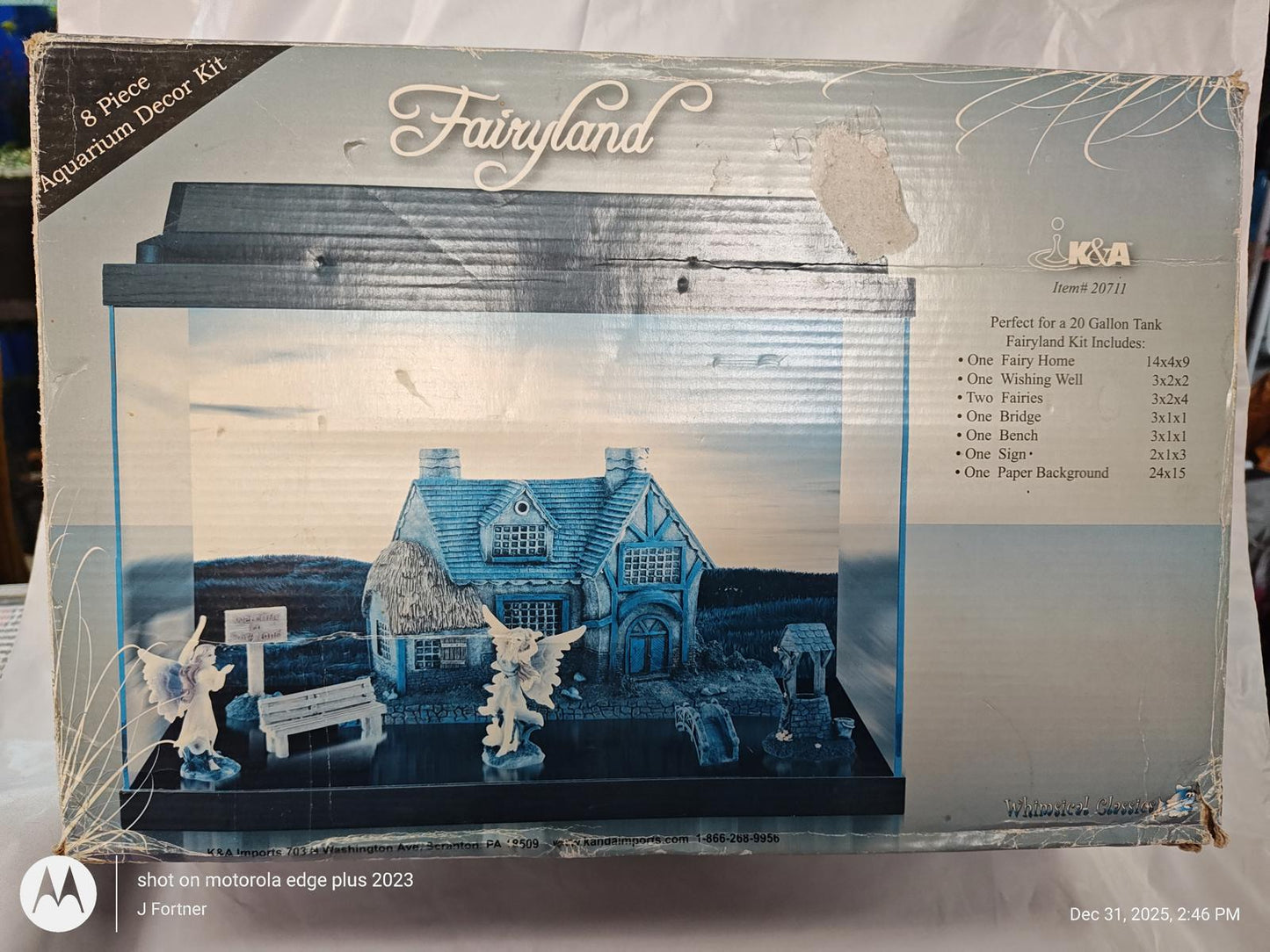 Fairyland dollhouse kit featuring a charming cottage and decorative figures.