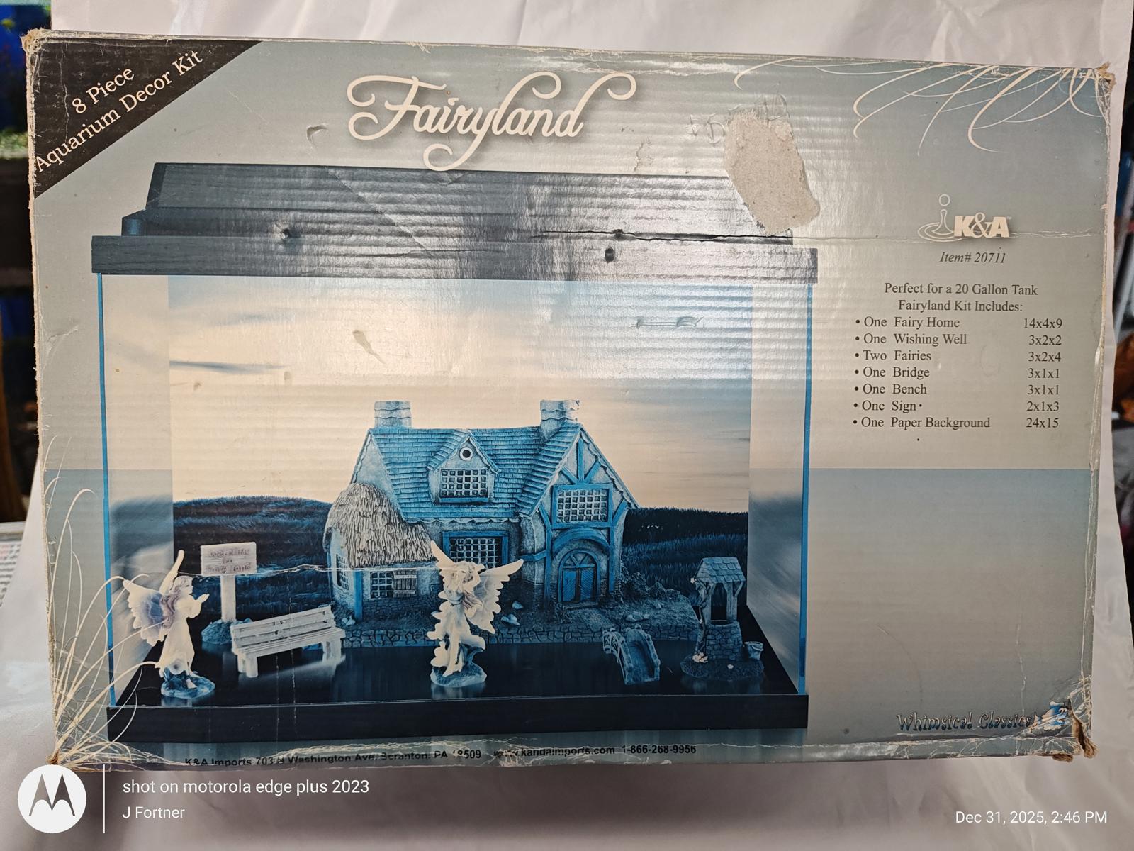 Fairyland dollhouse kit featuring a charming cottage and decorative figures.