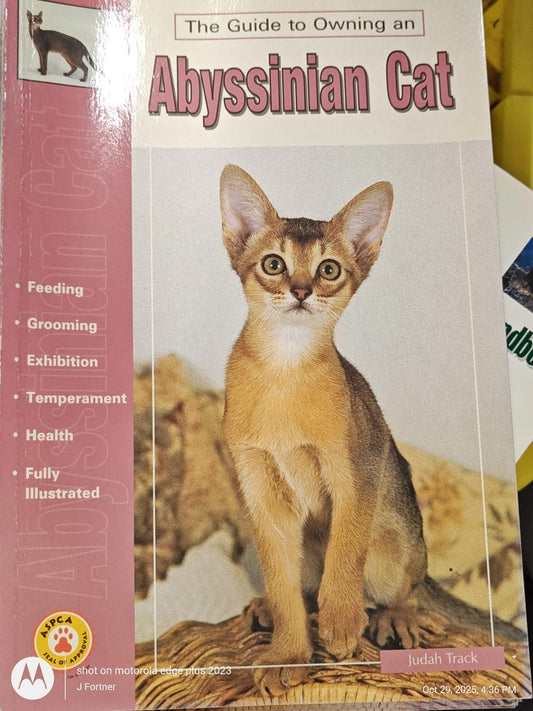 Abyssinian Cat guidebook featuring a beautiful Abyssinian cat on the cover.