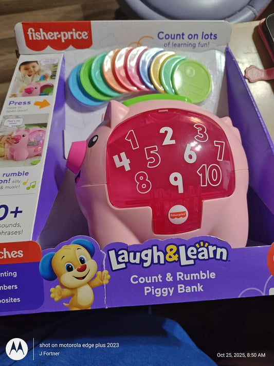 Fisher-Price Laugh & Learn Count and Rumble Piggy Bank with colorful coins and interactive features.