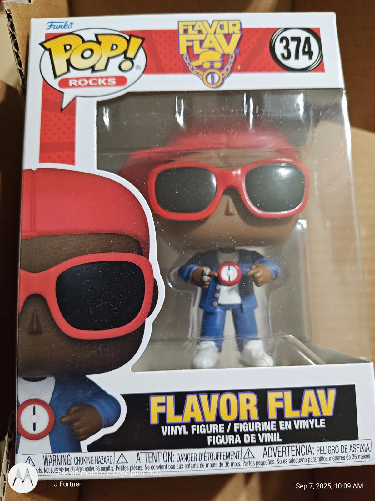 Flavor Flav vinyl figure in red sunglasses and blue outfit, part of the Funko Pop! Rocks collection.