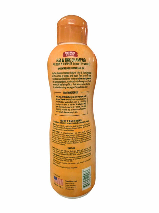 Flea & Tick Shampoo for dogs and puppies, featuring a bright orange bottle with detailed instructions.