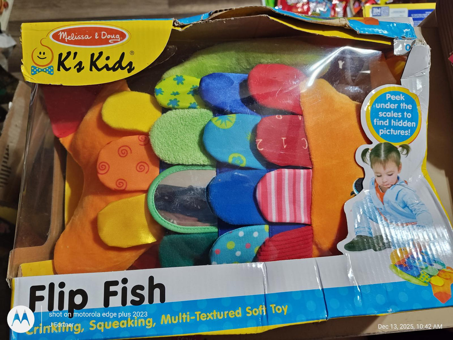 Flip Fish soft toy featuring colorful, textured fabrics for sensory play.