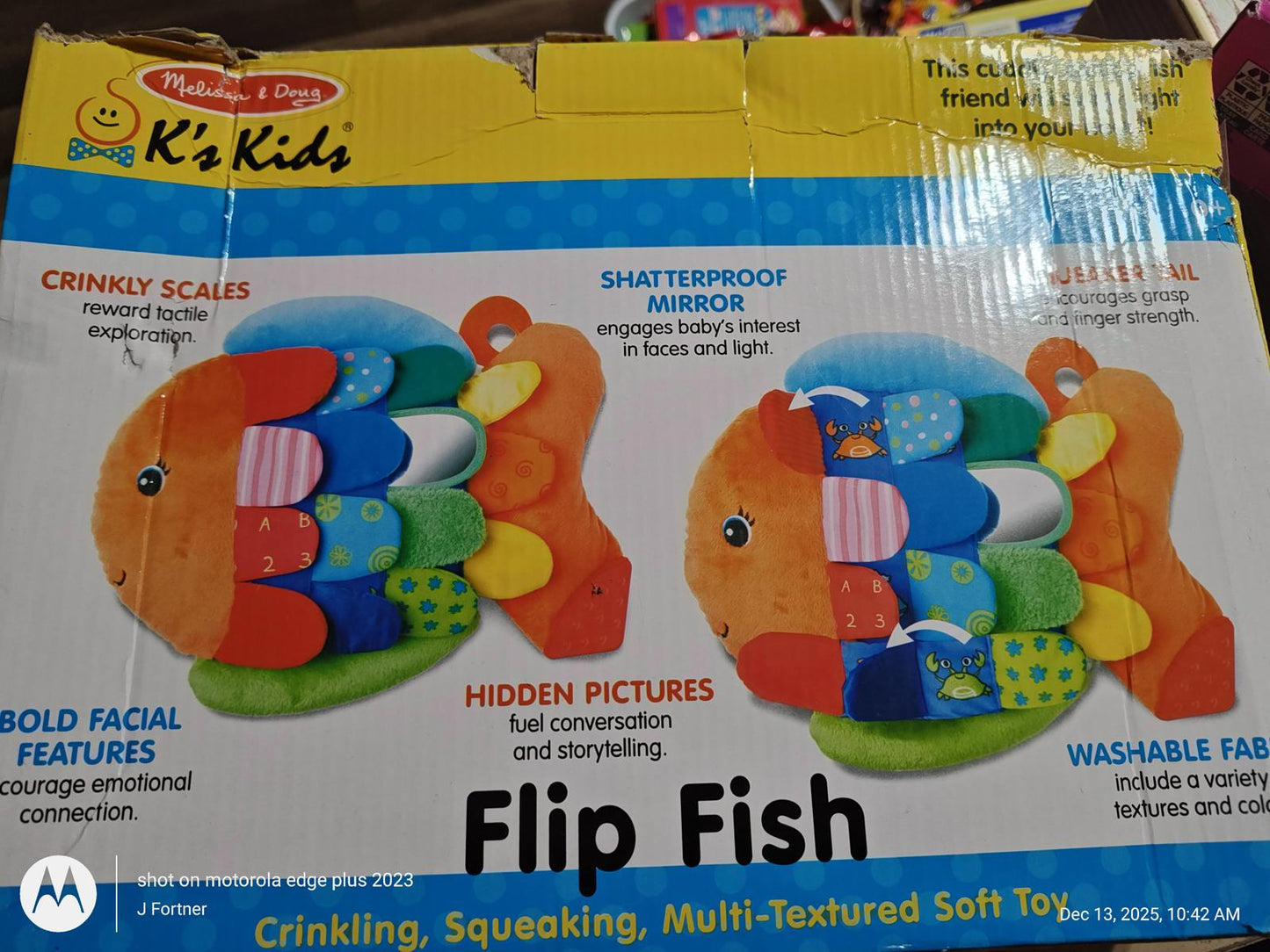 Flip Fish toy featuring crinkly scales, bold facial features, and hidden pictures for sensory play.