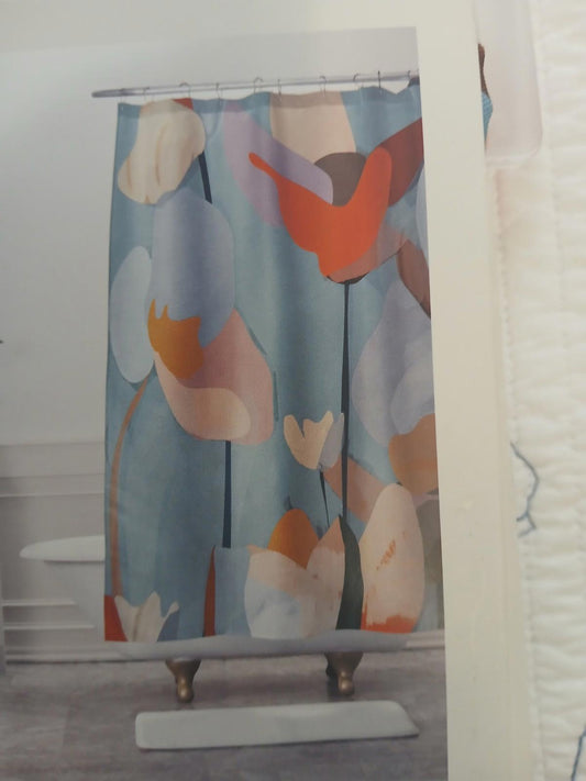 Floral Shower Curtain featuring colorful abstract flowers on a light blue background.