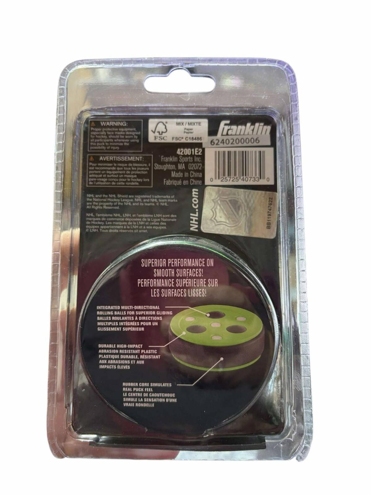 Franklin performance super grip hockey puck with a green design and packaging details.