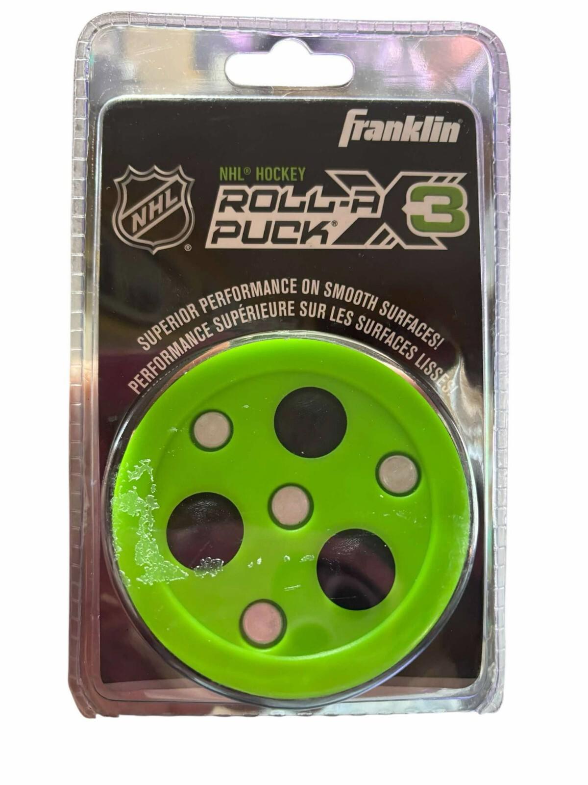 Roll-A-Puck C3 by Franklin in bright green with black and white dots for hockey training.