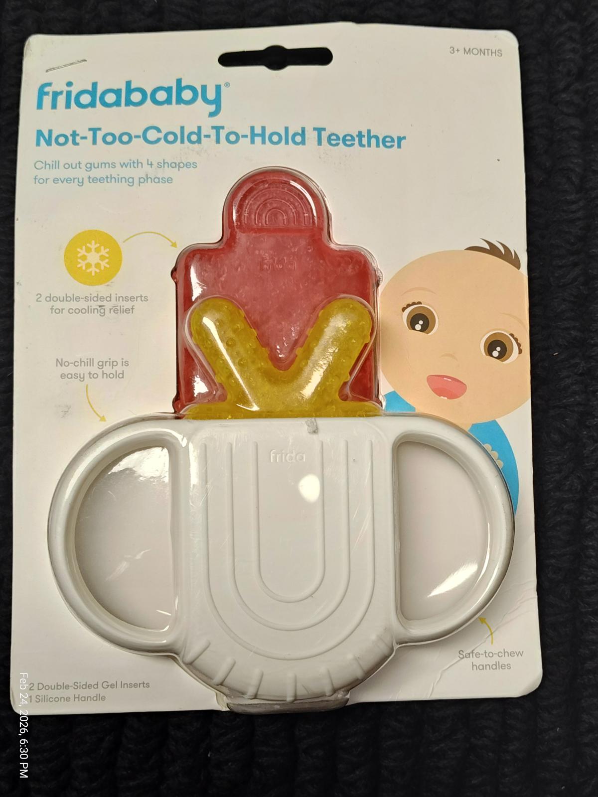 Fridababy Not-Too-Cold-To-Hold Teether in packaging, featuring a red and yellow design for easy gripping.