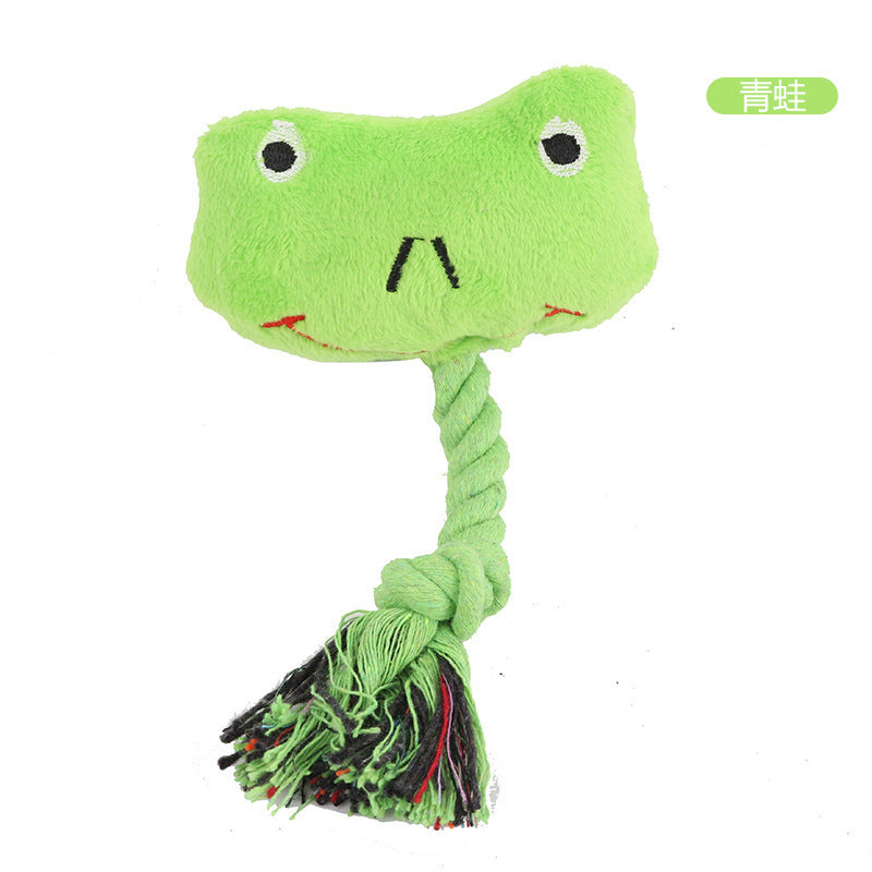 Frog plush dog toy with a braided rope tail and colorful tassels.