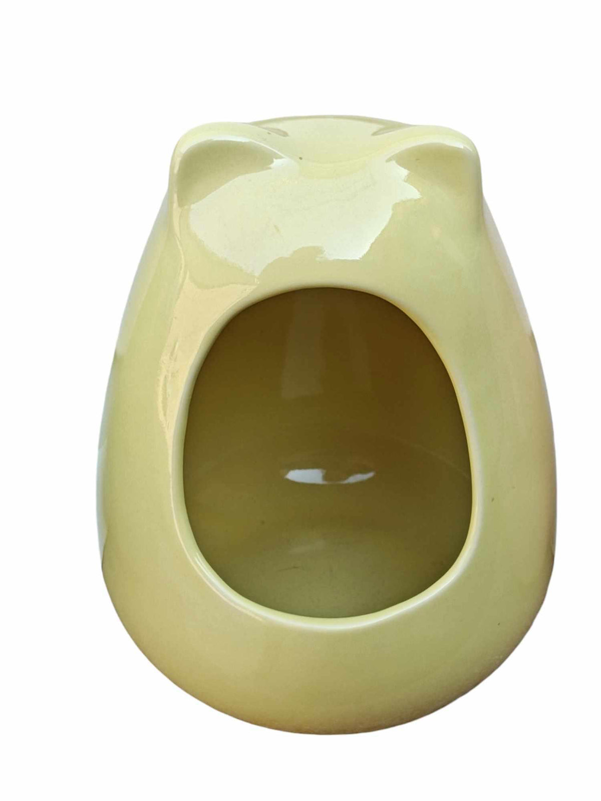 Frog-shaped ceramic pet house in soft yellow color, perfect for small animals.