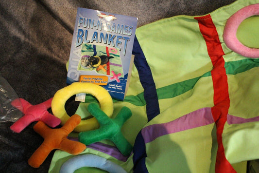 Fun Games Blanket with colorful rings and game instructions, perfect for interactive play.