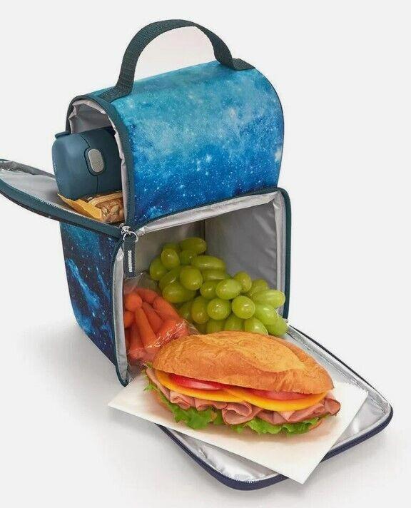 Galaxy-themed lunch box featuring a sandwich, grapes, and carrots inside.