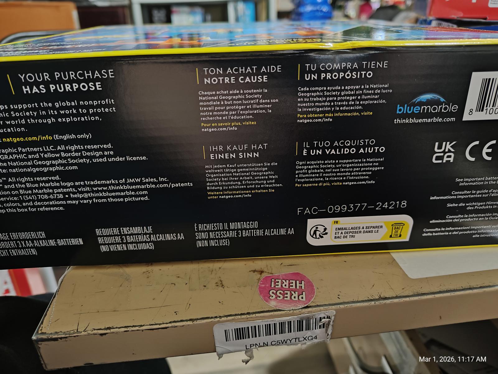 Product packaging for a toy with purpose-driven messaging and multilingual instructions.
