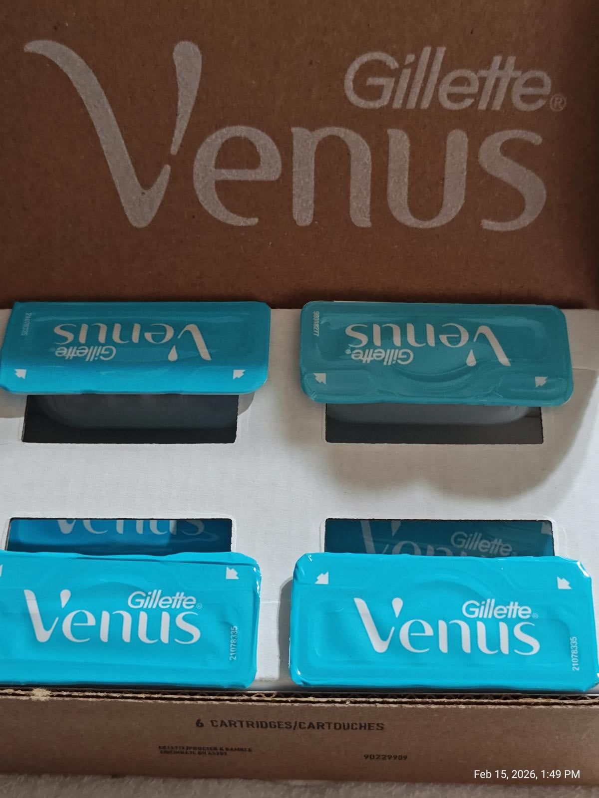 Gillette Venus razor cartridges in a blue packaging, neatly arranged in a box.