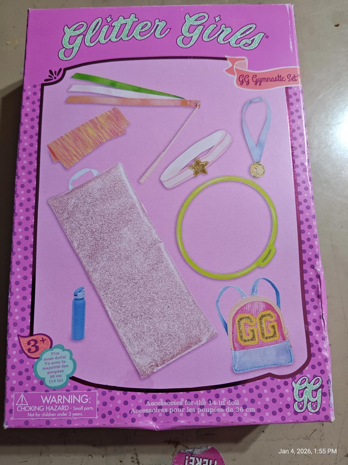 Glitter Girls accessory set featuring colorful hairbands, a sparkly towel, and a backpack.