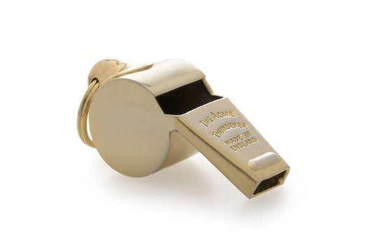 Gold referee whistle with keychain attachment for sports officiating.