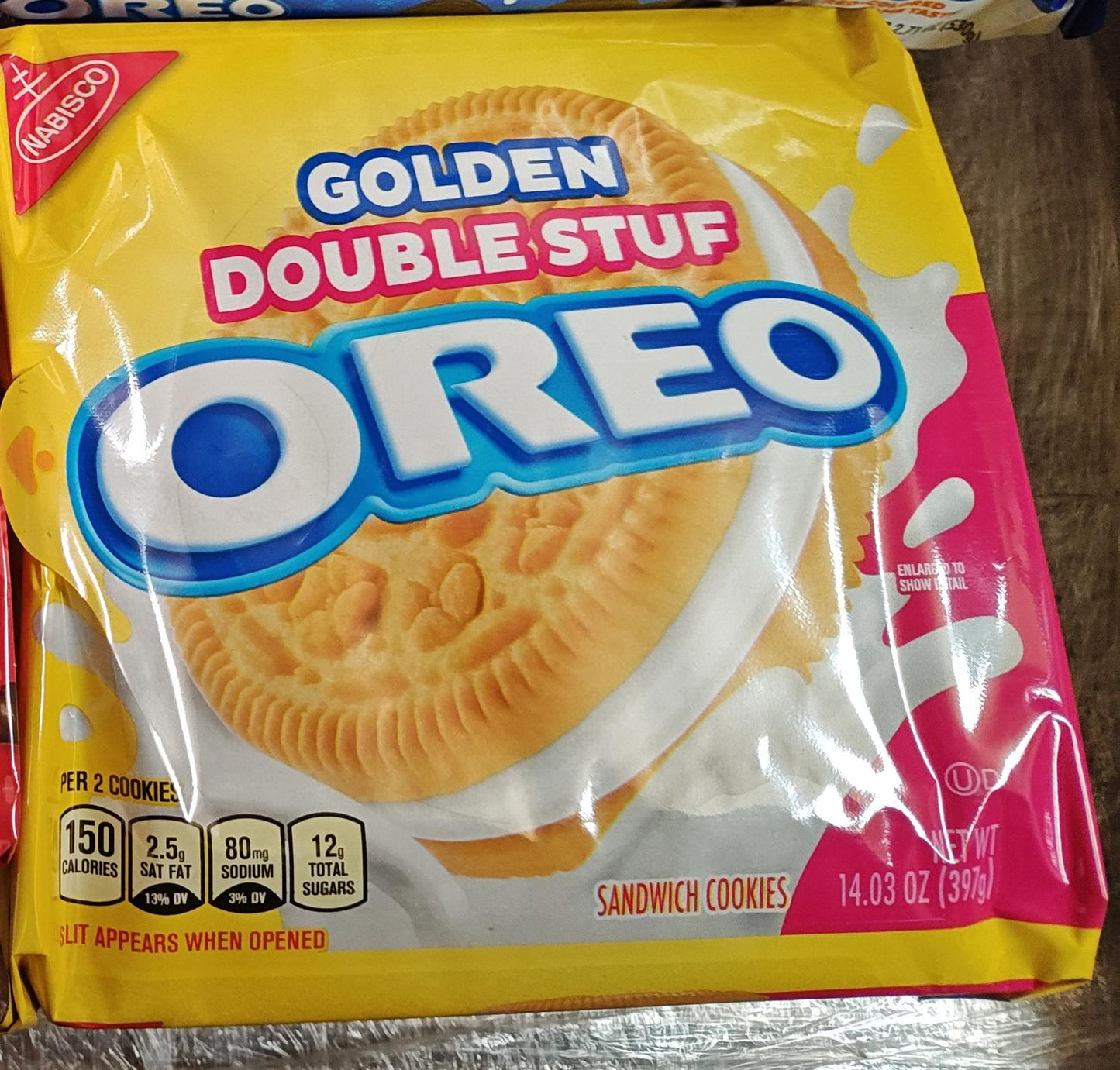 Golden Double Stuf Oreo sandwich cookies with creamy filling in a vibrant yellow package.