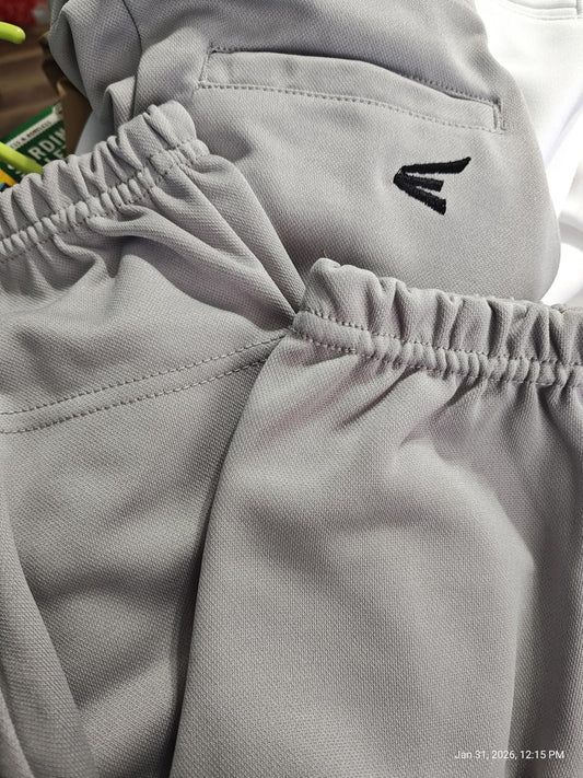 Gray athletic shorts featuring elastic waistband and logo detail.