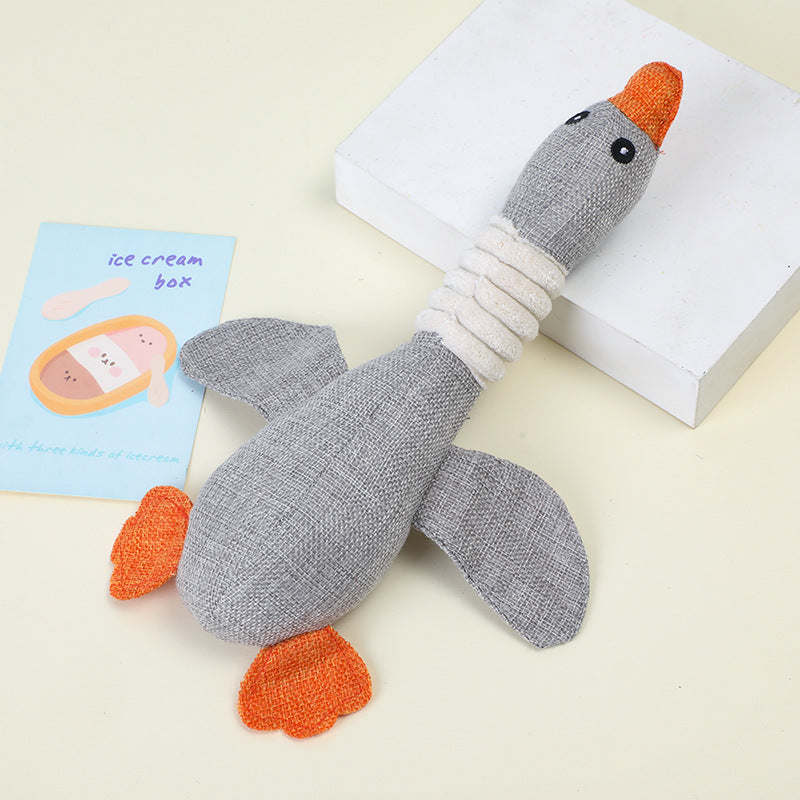 Gray plush goose toy with orange beak and feet, perfect for playtime.