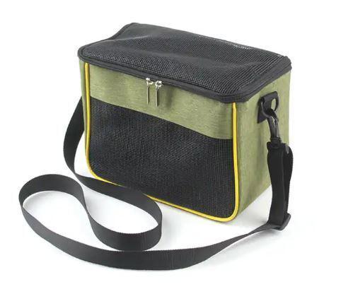 Green insulated lunch bag with black top and yellow trim, featuring a shoulder strap.
