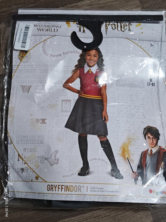 Gryffindor costume featuring a girl in a red and gold sweater and black skirt.