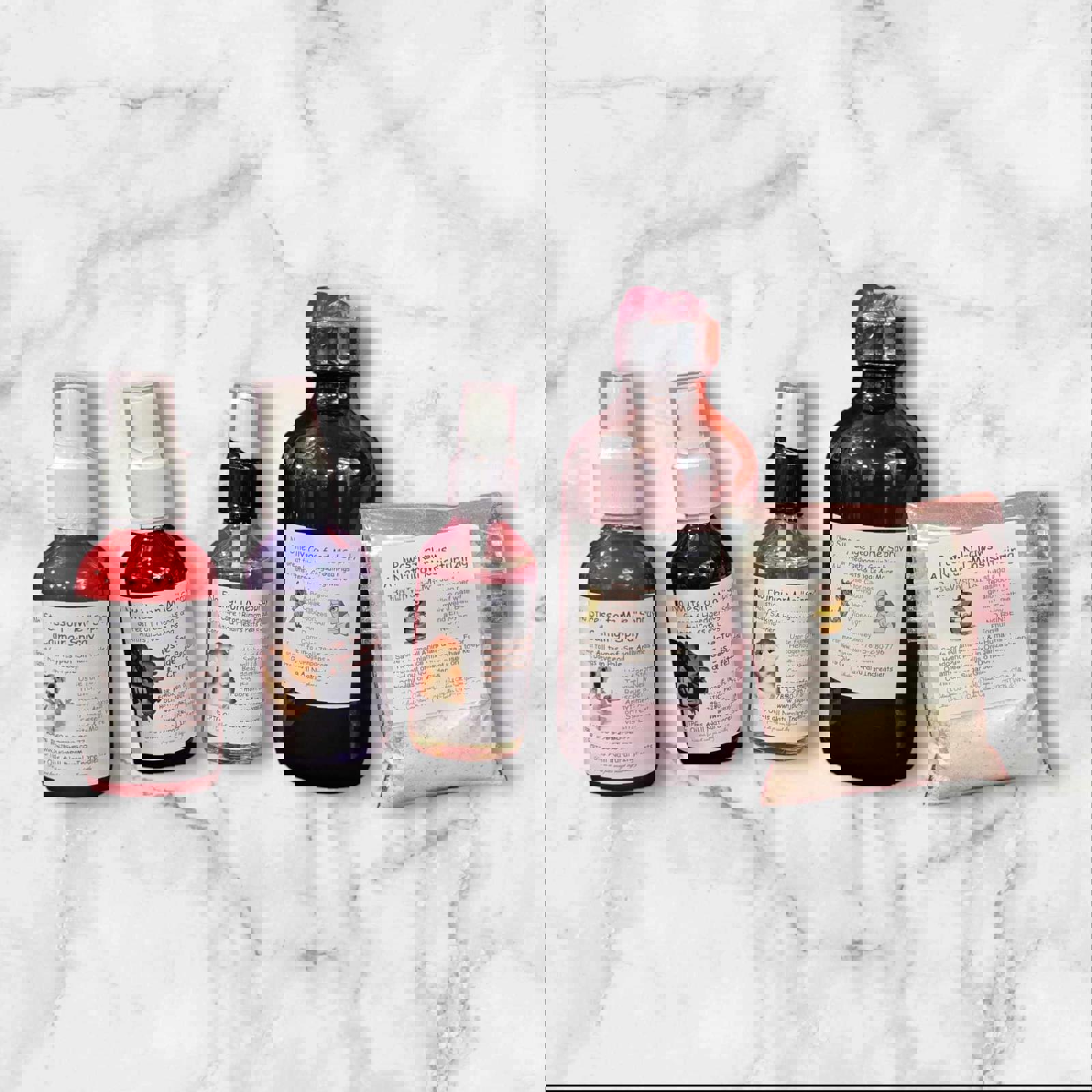 Natural Hair Care Set includes five bottles with various hair treatment solutions and a powder packet.