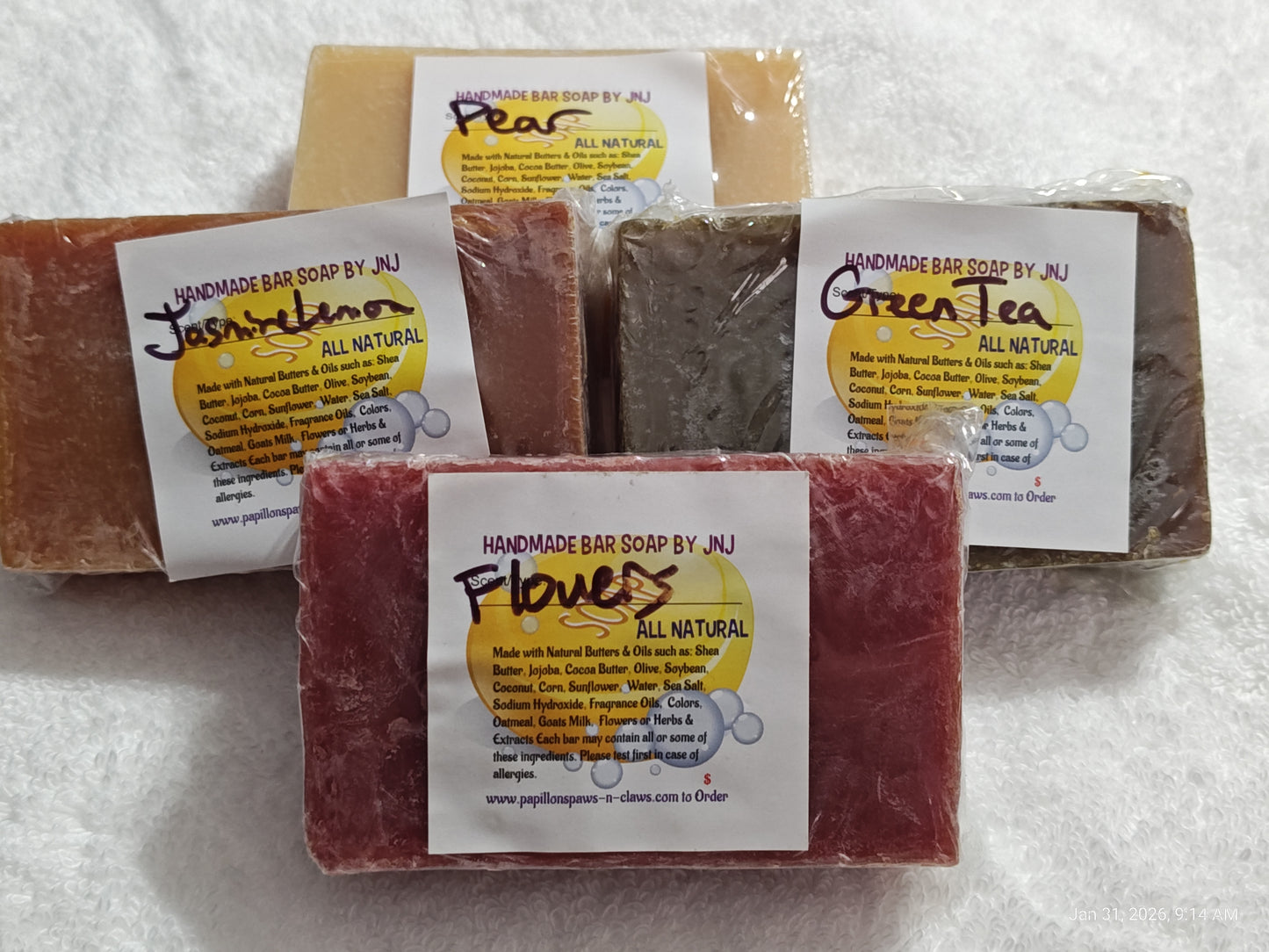Handmade soap by AJ featuring jasmine, green tea, flowers, and peas in natural colors.