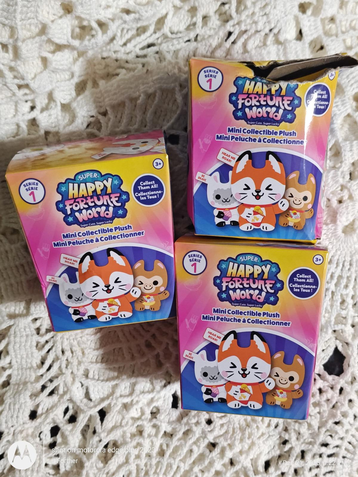Happy Fortune World mini collectible plush boxes featuring cute animal characters.