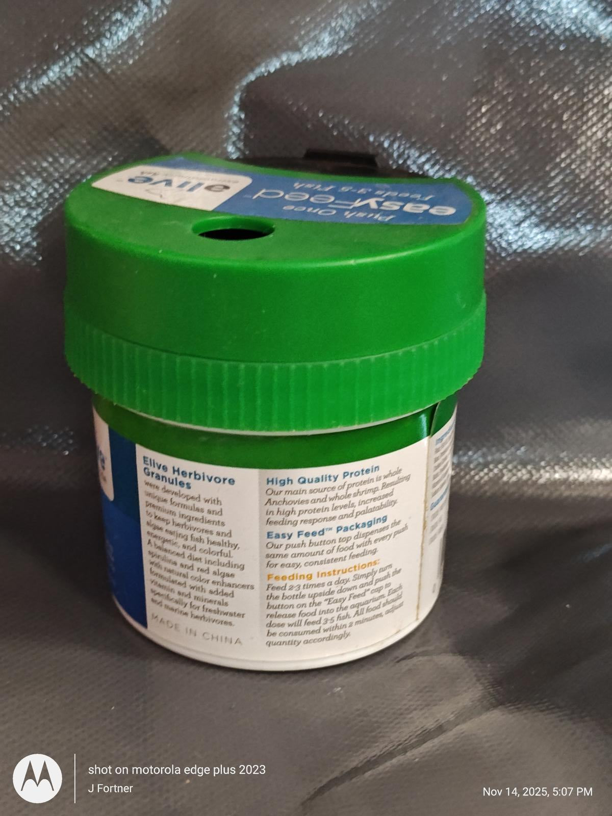 Herbivore's Green Food Supplement container with a green lid and detailed label.
