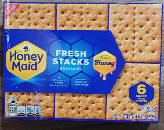 Honey Maid Fresh Stacks graham crackers in a box featuring six snack servings and honey drizzle.