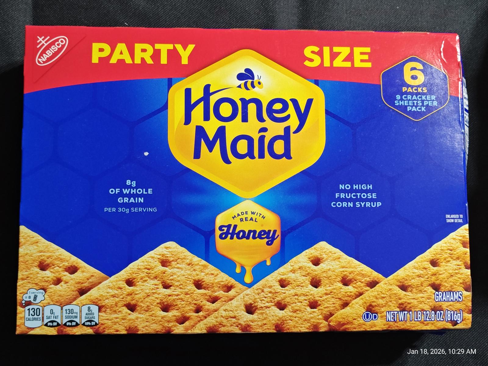 Honey Maid graham crackers party size box featuring whole grain and honey flavor.